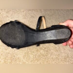 Black and glittery heels, size 7.